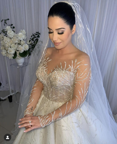 C2023-LS31A - Vestido de novia evasé de manga larga transparente con pedrería