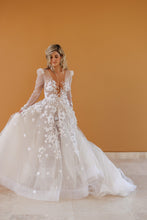 C2024-LS75V - Sheer long sleeve wedding gown with deep v-neck and a-line style skirt