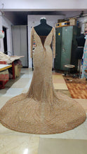 C2023-SWeeks - Nude colored crystal beaded plus size long sleeve wedding gown