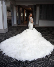 C2022-SLSB448 - Sheer long sleeve plus size wedding gown with Swarovski Crystal Bling