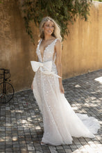 C2022-SV553 - sleeveless sexy deep v-neck wedding gown with bow.