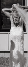 C2023-SV0213 sleeveless v-neck white wedding gown with 3D embellishments