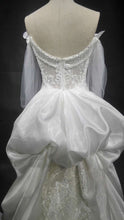 robe de mariée couture à manches longues et transparentes à VENDRE 