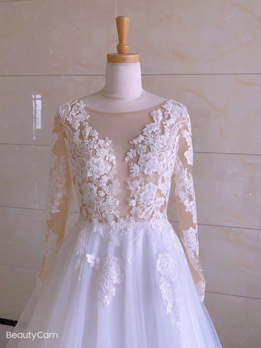 Vestidos de novia de talla grande con escote ilusión y mangas