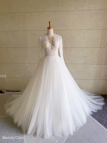 Vestido de novia evasé de manga larga transparente