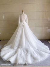 Sheer long sleeve a-line wedding gown