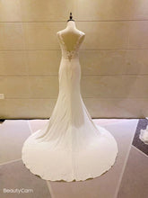 Sleeveless lace bodice wedding gown