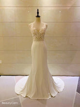 Sleeveless lace bodice wedding gown
