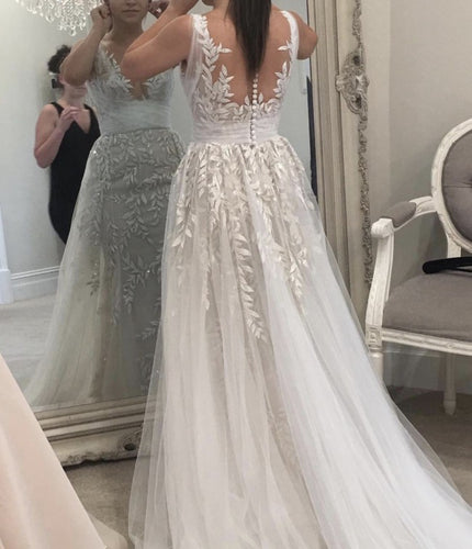 Vestido de novia de corte A, sin mangas y con espalda transparente