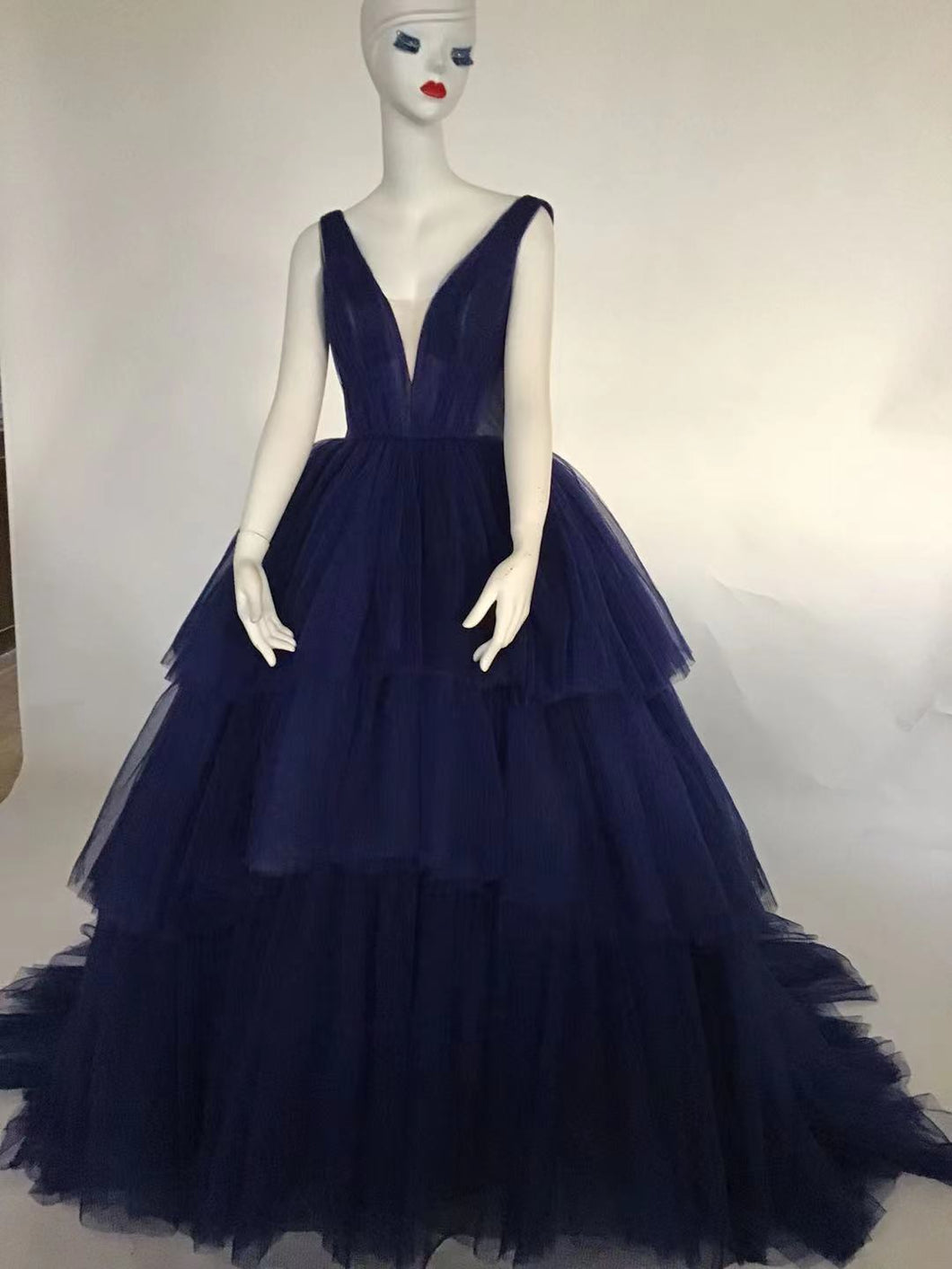 Style DOL31 - Sleeveless v-neck formal ball gown with tiered skirt