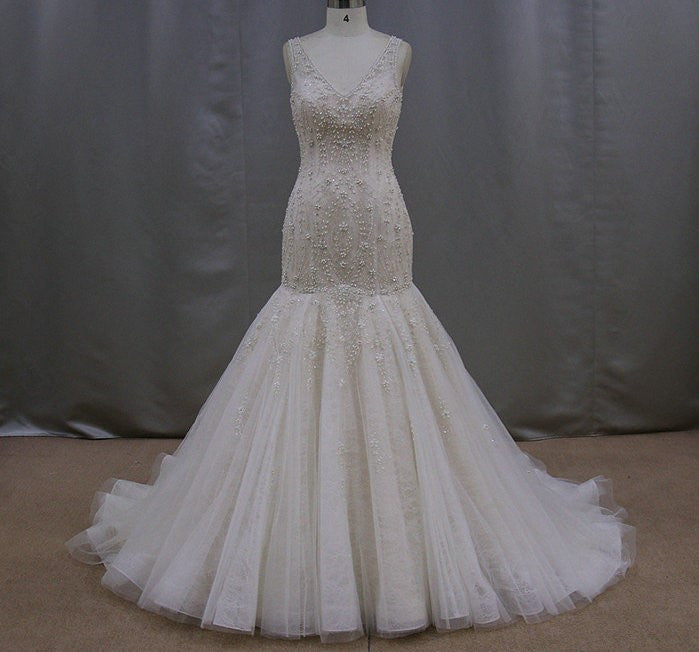 Sleeveless beaded wedding dresses with a v-neck line